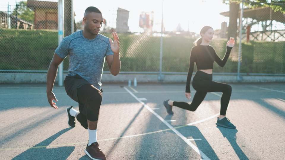 man and woman doing workout